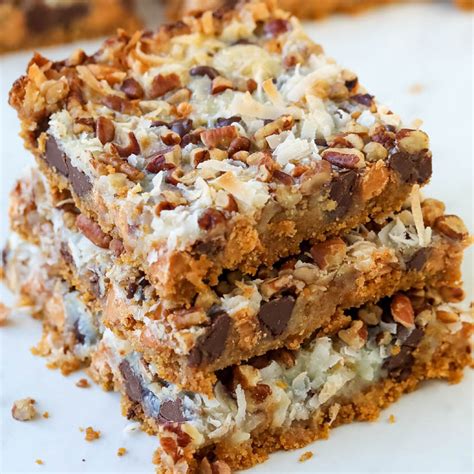 these 7 layer magic cookie bars are made with seven delicious layers crushed graham cracker