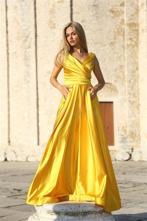 Women In Yellow Dresses In The Square Stock Photo Image Of Outdoor