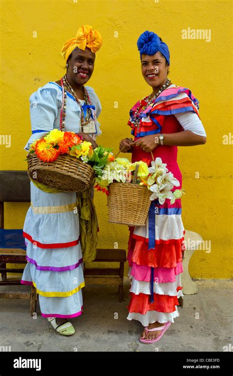 Side View Of Women In Cuban Traditional Dresses Stock Photo