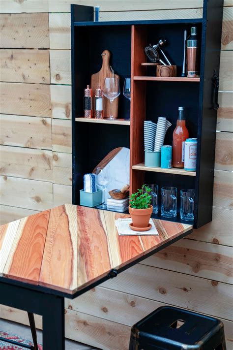 Once opened, this handsome bar features a hidden drawer, numerous shelves, wine racks, glass storage, and about anything else regarding bar storage. How to Build a Fold-Down Outdoor Bar | Building a deck ...