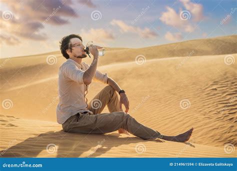 Man Feels Thirst And Drinks Water In The Desert Stock Photo Image Of