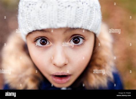 Portrait Of Little Girl With Eyes Wide Open Stock Photo Royalty Free
