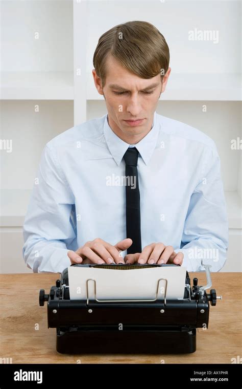 A Man Using A Typewriter Stock Photo Alamy