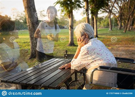 A Lonely Senior Woman Is Waiting And Thinking Old Memories Of Her