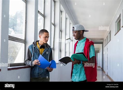Students Standing In Hallway Chatting Stock Photo Alamy