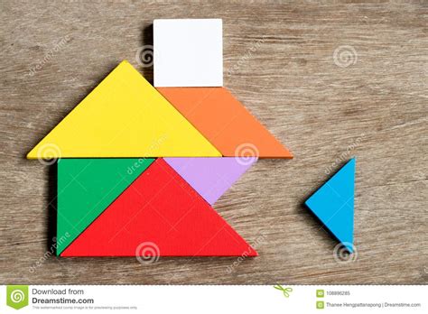Colorful Tangram Puzzle In Home Shape Wait For Fulfill Stock Image