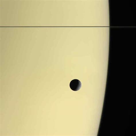 Tethys Floating Past Saturn Universe Today