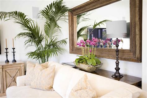 The wall above the couch can make a perfect place for a large central mirror that offers a hang your mirror at least a foot above the couch and make sure it's perfectly centered to keep it from looking double check that your china is resting securely in the holders so it doesn't topple over accidentally. A thin console between the sofa and the wall behind it ...