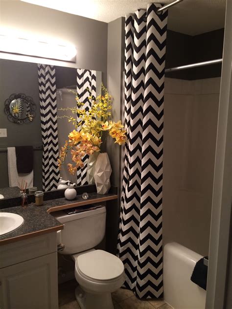 This one above boasts nine mesh pockets that are accessible from inside the shower, perfect for storing soap, shampoo, conditioner, and more. Black, white, yellow small bathroom. Chevon floor to ...