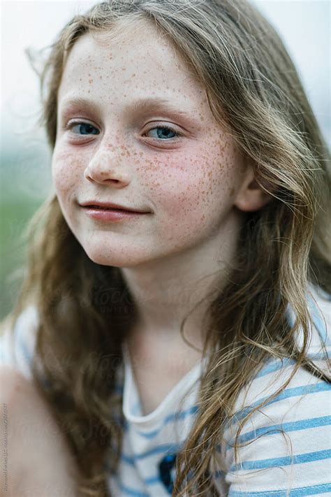 Portrait Of Pretty Young Redhead Girl With Freckles With Smile By Stocksy Contributor Raymond