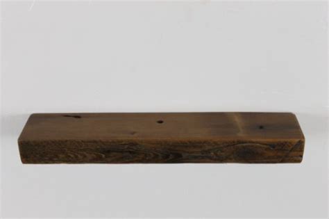 The set of three shelves are made of solid wood with a dark stain that'll elevate any space in your home. 18" wide x 4" deep x 2" high, Reclaimed Floating Wood ...
