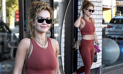 rita ora flaunts her figure in a crop top and leggings as she leaves the gym in sydney