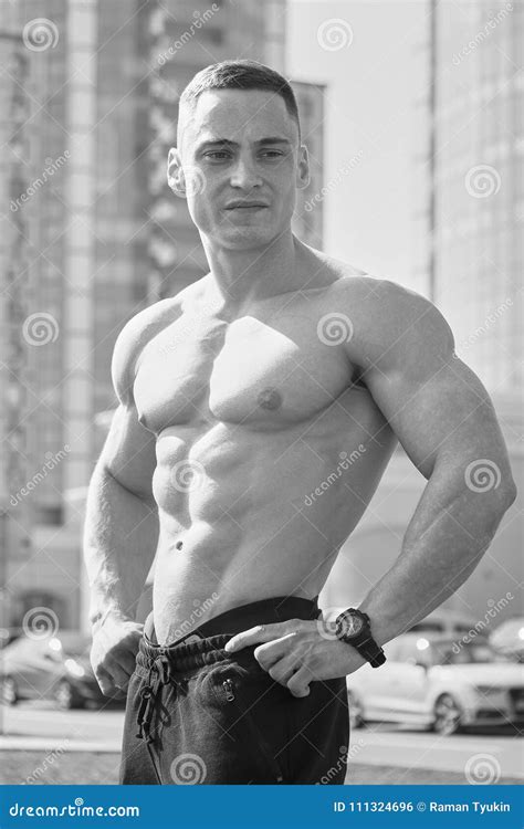 Muscular Shirtless Man Posing Looking Away Outdoors Black And White Stock Photo Image Of