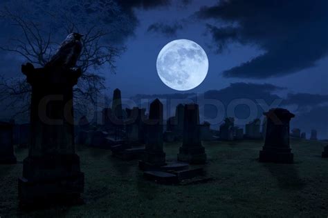 Spooky Night At Cemetery With Old Gravestones Full Moon And Black