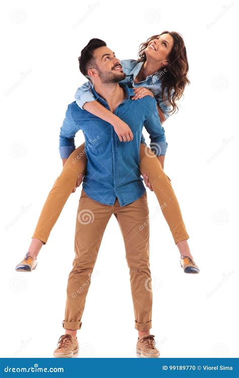 Man Carrying Woman On His Back Both Looking Up Stock Photo Image Of