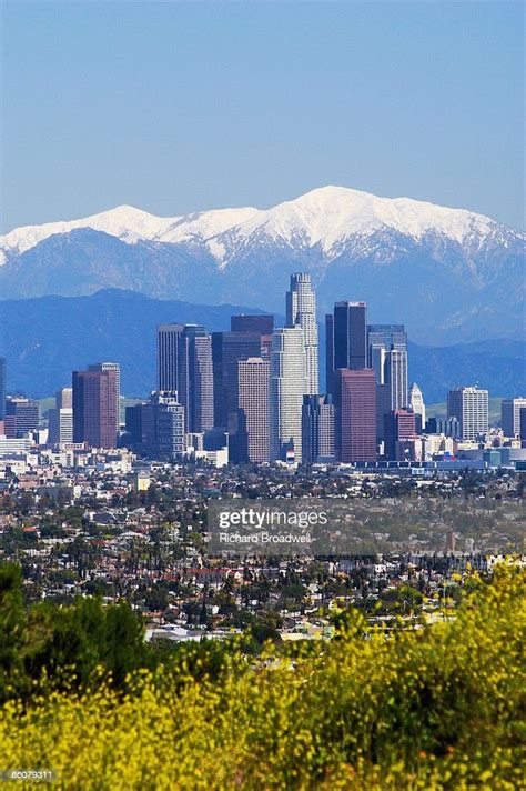 Los Angeles Skyline With Snowcapped Mountains California High Res Stock