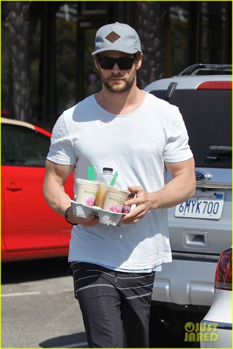 Full Sized Photo Of Chris Hemsworth Muscles Can Barely Fit In His Shirt