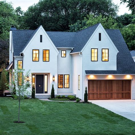 Featuring A White Stucco And Cedar Exterior This Stunning Home By