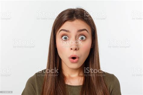 Closeup Portrait Of Surprised Beautiful Girl Holding Her Head In
