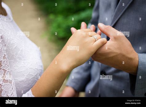 Married Couple Holding Hands Showing Wedding Ring Stock Photo Alamy