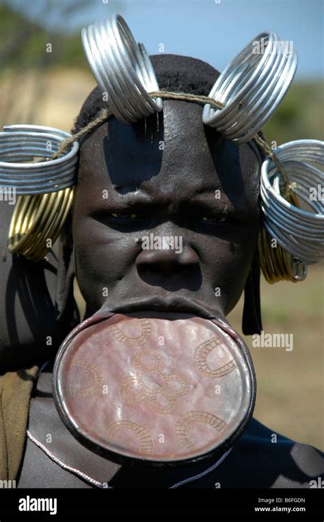Woman From The Mursi Tribe With A Plate Lip And Metal Tyres On Her Head Near Jinka Ethiopia