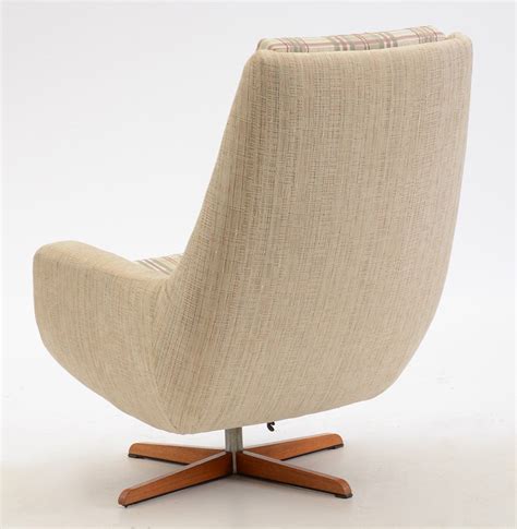 Mid-century modern upholstered reclining swivel chair