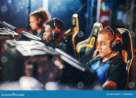 Focused On Game Male Cybersport Gamer Wearing Headphones Playing