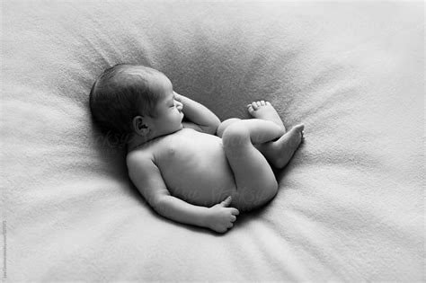 Beautiful Naked Newborn Baby Boy Sleeping Peacefully As If He Would