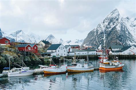 Reine Fishing Village With Snow Capped Mountains Norway