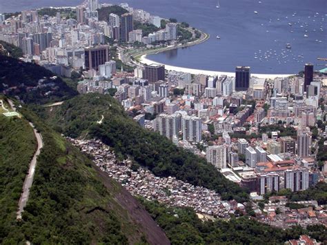 Beginning in santa marta, a favela of approximately 5,000 cariocas, federal aid was administered in order to invigorate the tourism industry. Favela Santa Marta | Clio-Photo