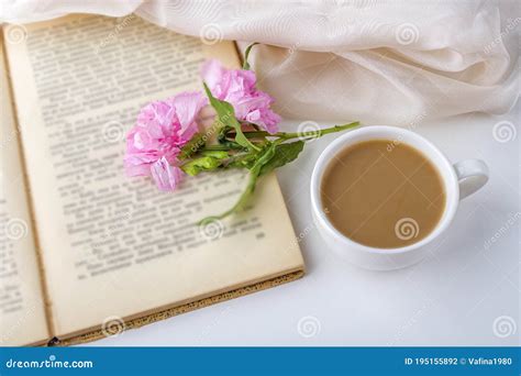 Romantic Vintage Still Life With Pink Flowers Old Book Cup Of Tea Or