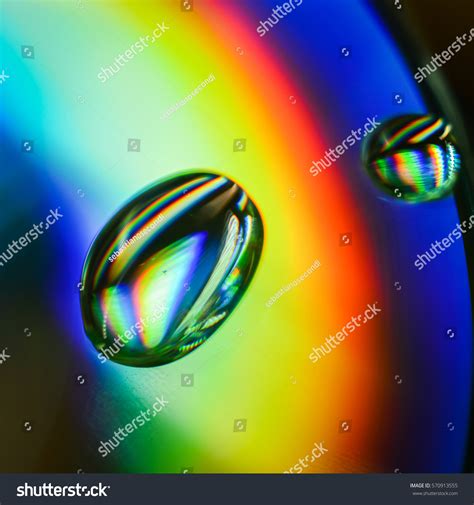 Light Diffraction Showing Rainbows On Water Stock Photo 570913555