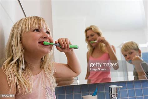 Brother And Sister Brushing Teeth Photos And Premium High Res Pictures Getty Images