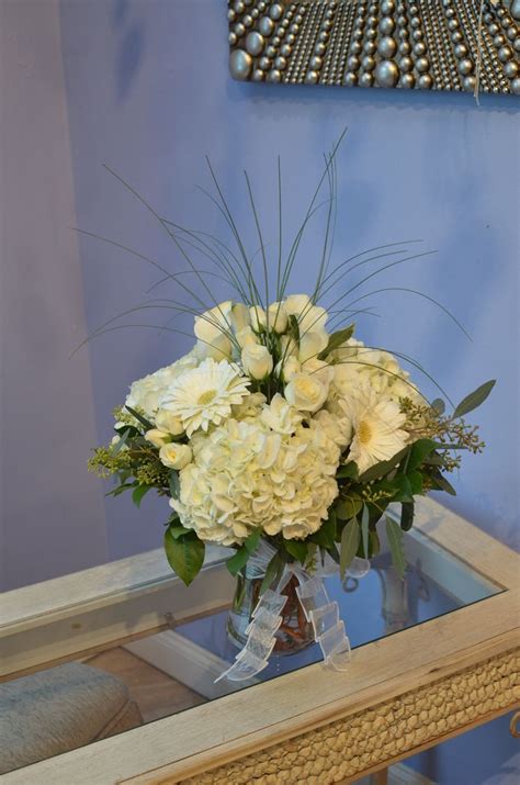All White Flowers Tastefully Arranged In A Gathering Vase White
