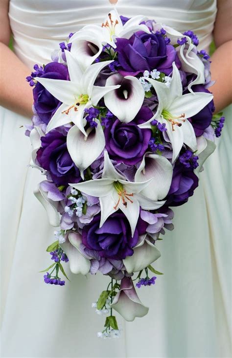 A Bridal Bouquet With Purple And White Flowers