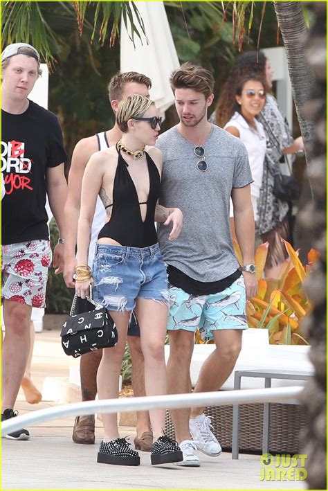 Miley Cyrus Patrick Schwarzenegger Get Flirty Poolside In Miami With Cody Simpson Photo