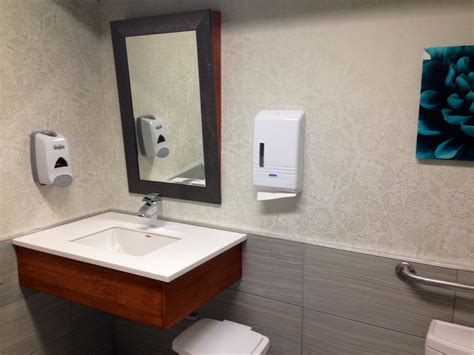 Have you seen curbless showers on websites and in magazines and dreamed of a new barrier free shower in your outdated master bath? Barrier free patient washroom. Custom maple vanity w ...