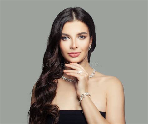 Jewelry Woman Young Woman With Makeup Long Curly Hair And Diamond