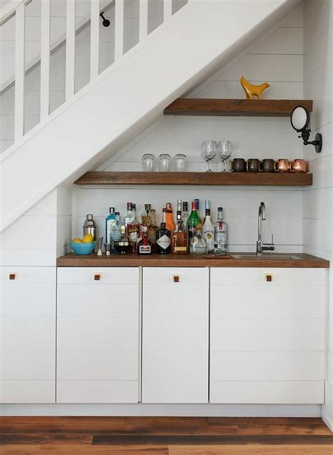You need to decide what goes under the lowest part of the stair tread and what part of the kitchen needs the coveted space with the most generous headroom. Shiplap Staircase Wall Design Ideas