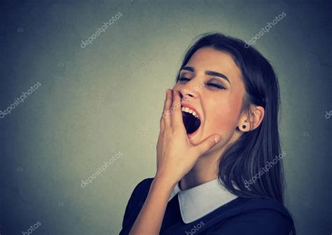 Sleepy Woman With Wide Open Mouth Yawning Looking Bored Stock Photo By