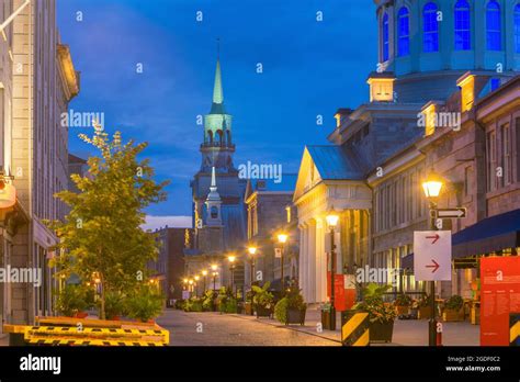 Old Town Montreal At Famous Cobbled Streets At Twilight In Canada Stock