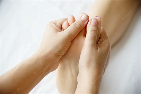 Free Photo Woman Receiving Foot Massage Service From Masseuse Close