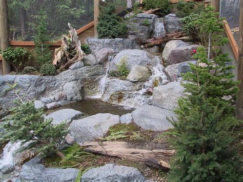 Concrete naturally feels like stone making it the perfect medium to create fake rocks that look and feel more. fake rock waterfalls | Yards by Aaron « Yard Deco ...