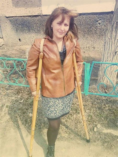 Amputee Woman On Crutches B