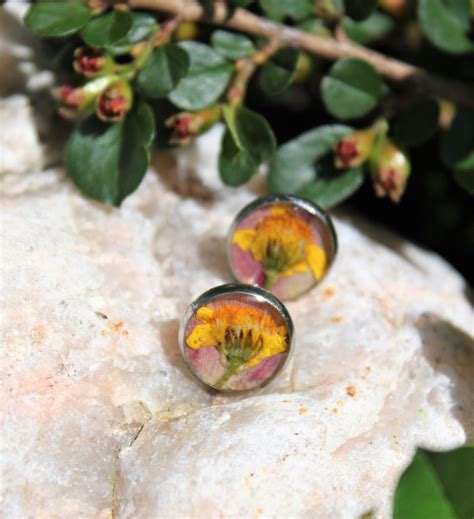 Maybe you would like to learn more about one of these? Pressed real flower resin earrings yellow stud earrings ...