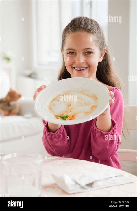 Young Girl Holding Plate Stock Photo Alamy