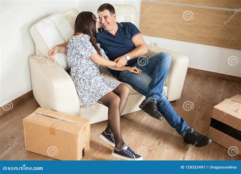 Couple Sitting On The Sofa On Their New House Stock Image Image Of