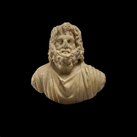 A Roman Marble Or Indurated Limestone Appliqué Bust Of Zeus Serapis