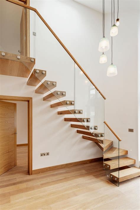 A Cantilever Or Floating Staircase With Oak Treads And Glass Balustrade