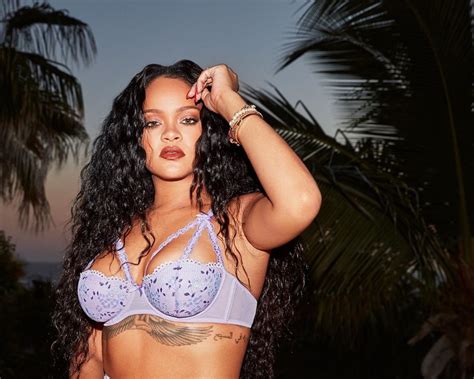 rihanna spills out of purple bra as she admits she s ‘usually humble but not about her sexy